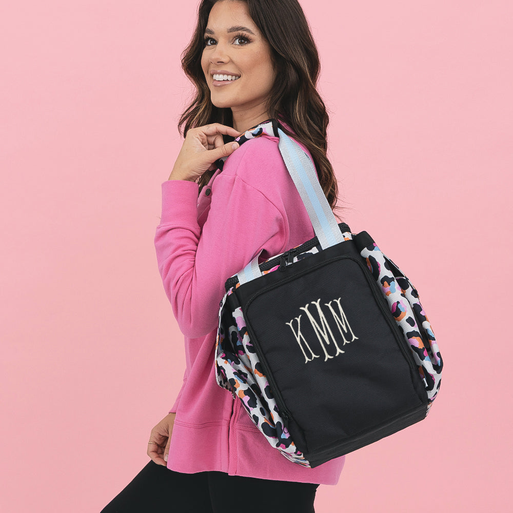 girl with sunset leopard extra large cooler tote folded over shoulder