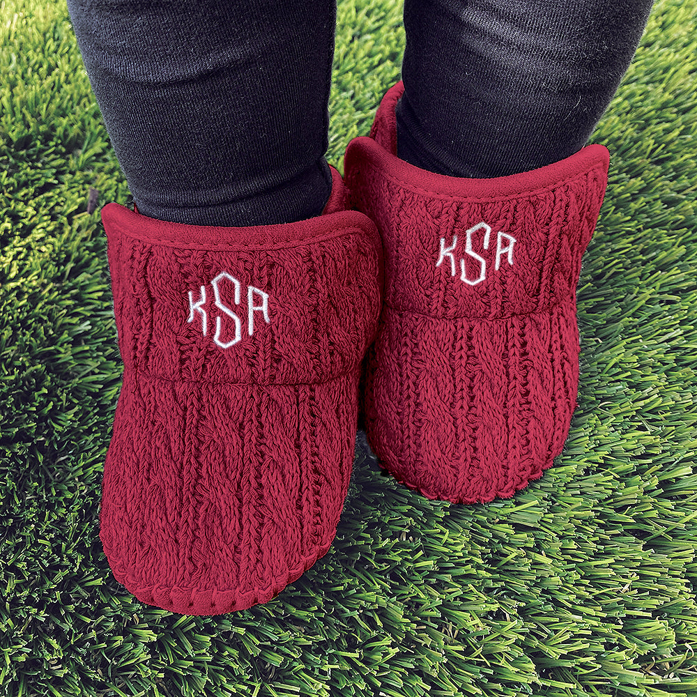 personalized crimson baby booties on grass