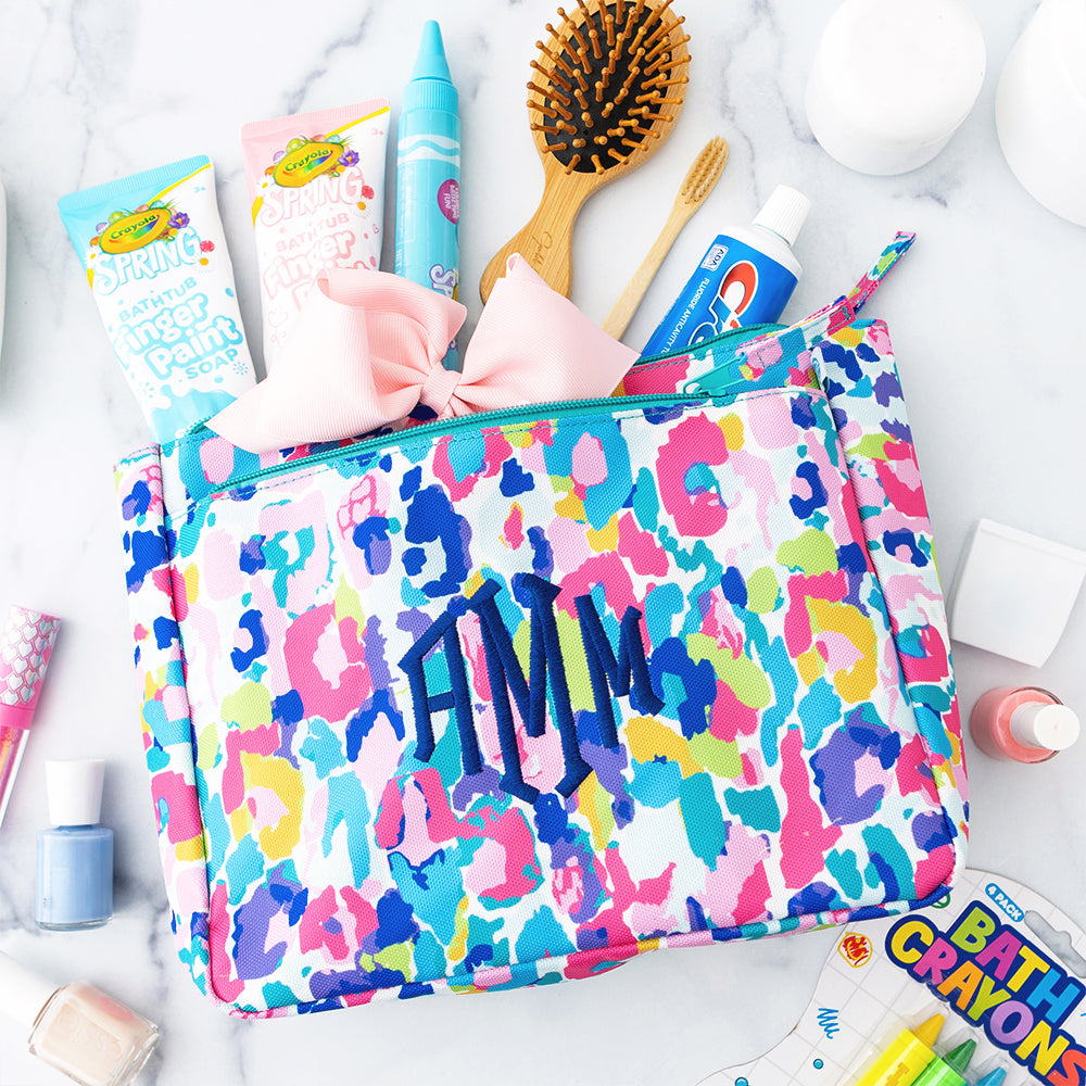 blue leopard kids toiletry bag flatlay