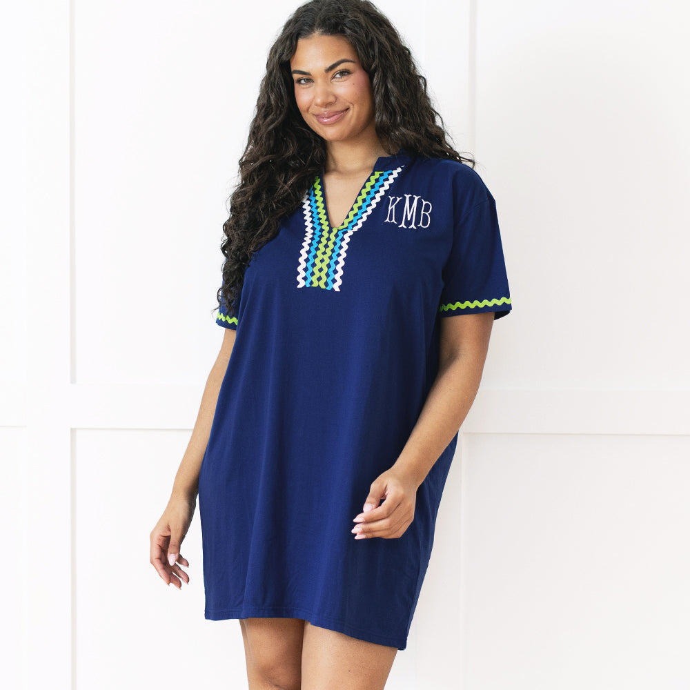 girl wearing navy monogrammed ric rac cover up