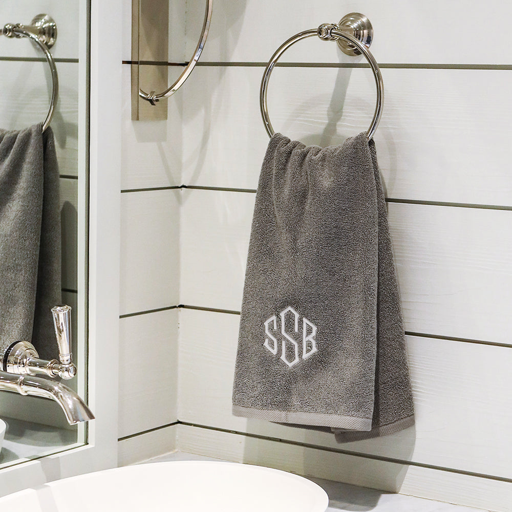 grey hand towel on towel holder