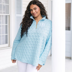 girl wearing personalized quilted quarter zip pullover in ice blue