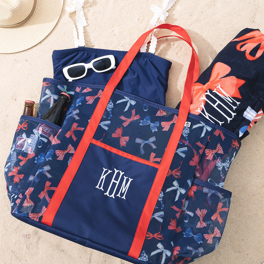 monogrammed mesh beach bag with america bow pattern in sand