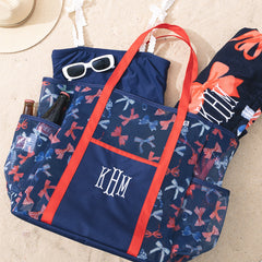 monogrammed mesh beach bag with america bow pattern in sand