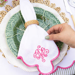pink scalloped napkin table setting