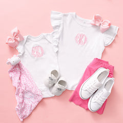 Matching white baby bodysuit and toddler shirt with ruffle sleeves
