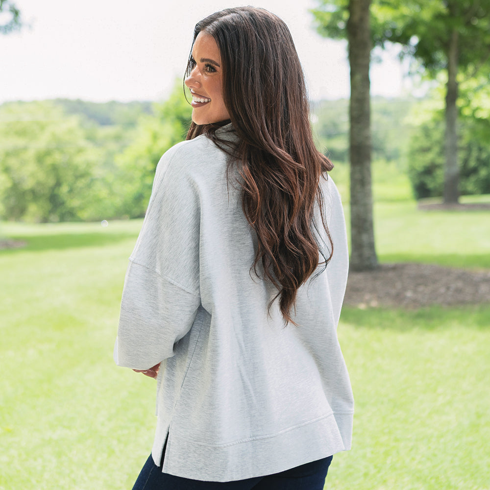 back of heathered grey oversized quarter zip pullover 