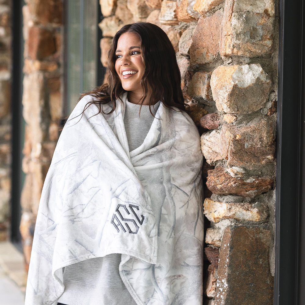 birch camo blanket wrapped up around girl