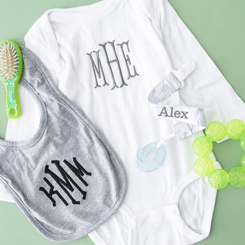 birch camo paci clip flatlay with updated name