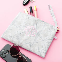 birch camo wristlet pouch spillshot flatlay