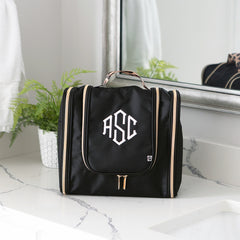 black classic cheetah hanging toiletry bag on bathroom counter