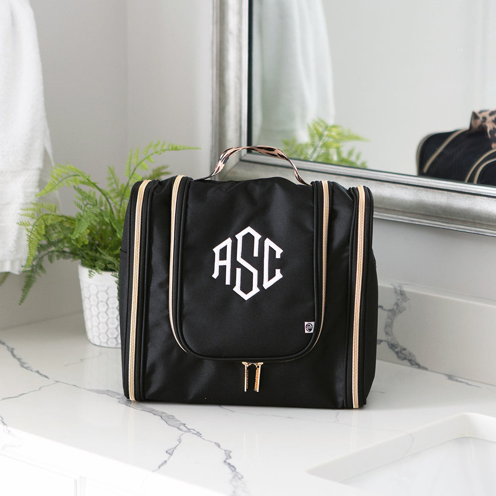 black classic cheetah hanging toiletry bag on bathroom counter