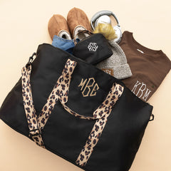 black classic cheetah makeup bag flatlay tan monogram