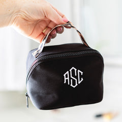 black classic cheetah makeup bag in hand