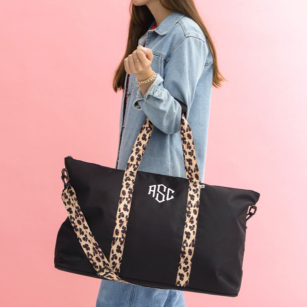 black classic cheetah weekend bag on arm