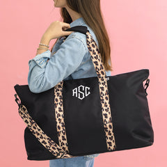 black classic cheetah weekend bag on shoulder