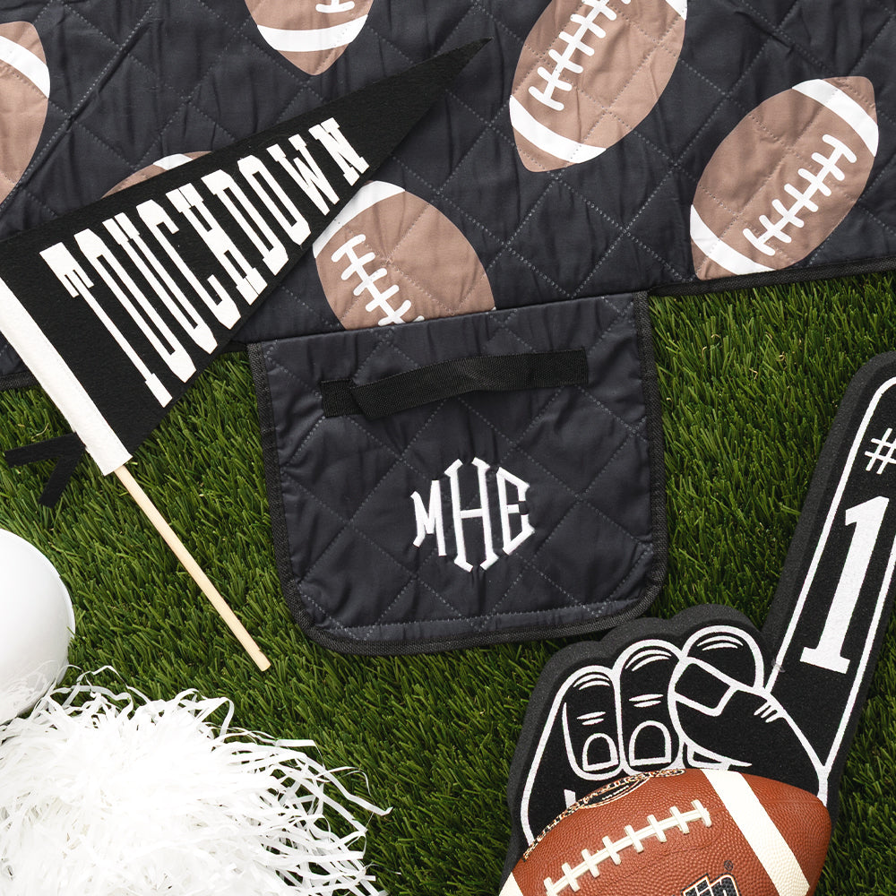 black football picnic blanket flatlay up close