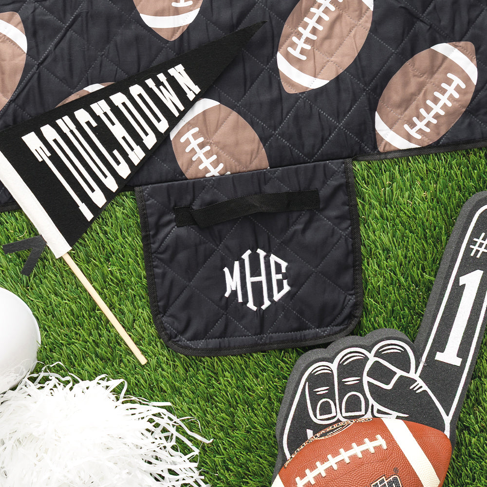 black football picnic blanket flatlay up close