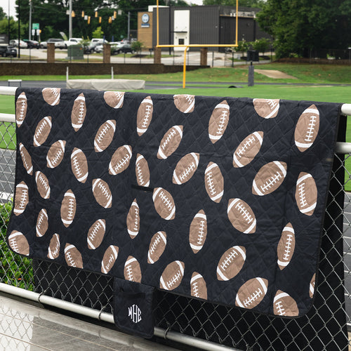 black football picnic blanket on fence