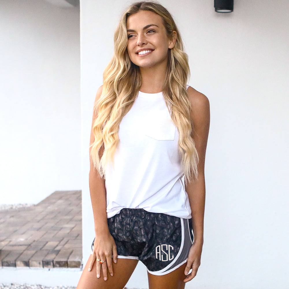 black leopard running shorts with white tank top