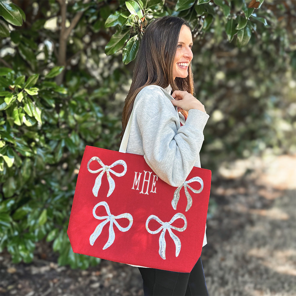 bows sequin tote bag on shoulder