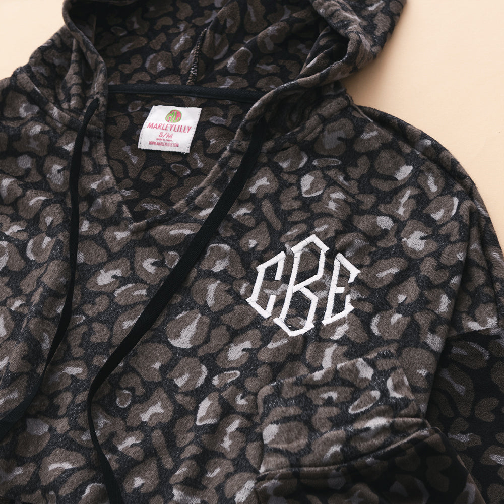 close up of monogrammed softspun pullover in onyx leopard