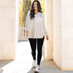 girl wearing monogrammed softspun pullover in snow leopard