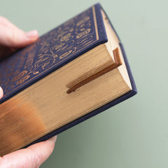 brown corner bookmark in closed book close up