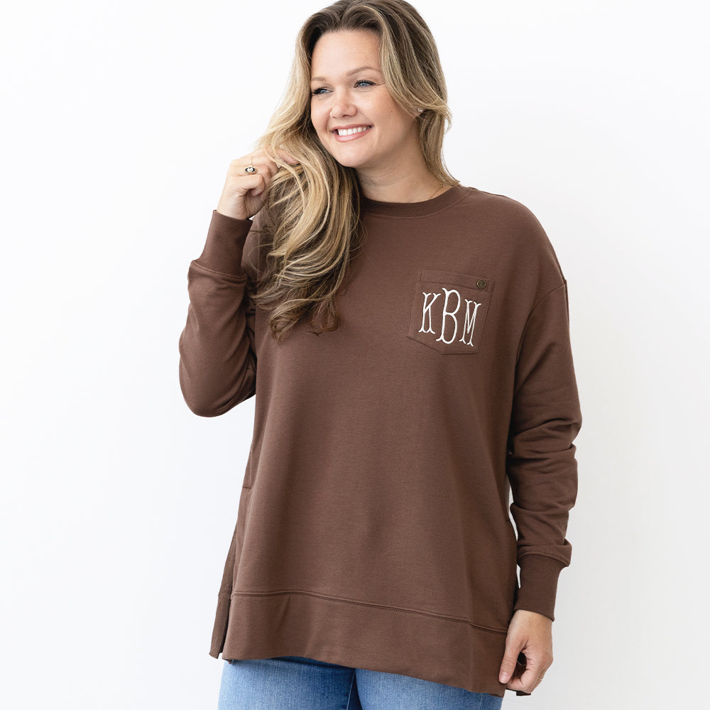 brown crewneck sweatshirt on emily