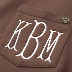 brown crewneck sweatshirt up close