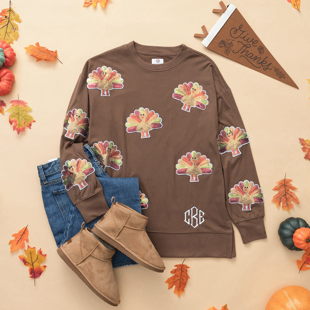 brown sequin turkey sweatshirt flatlay