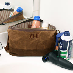 spring 23 personalized mens dopp kit on bathroom counter with toiletries