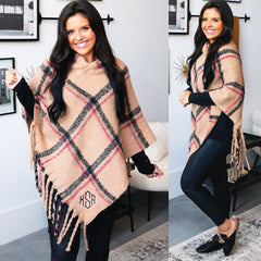 girl wearing monogrammed poncho 