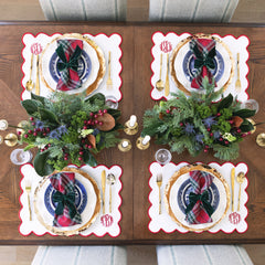 christmas bow napkins holders on tablescape with scalloped napkin and placemat 