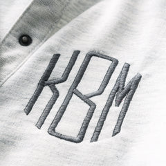 close of heathered ivory monogram on essential pullover 