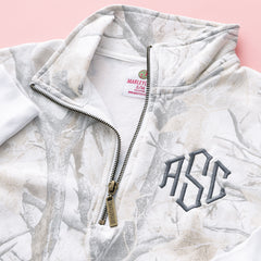 close up of birch camo monogrammed quarter zip sweatshirt 