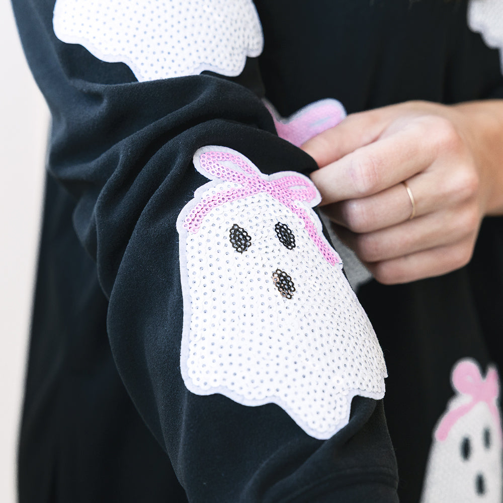 close up of black sequin ghost sweatshirt 