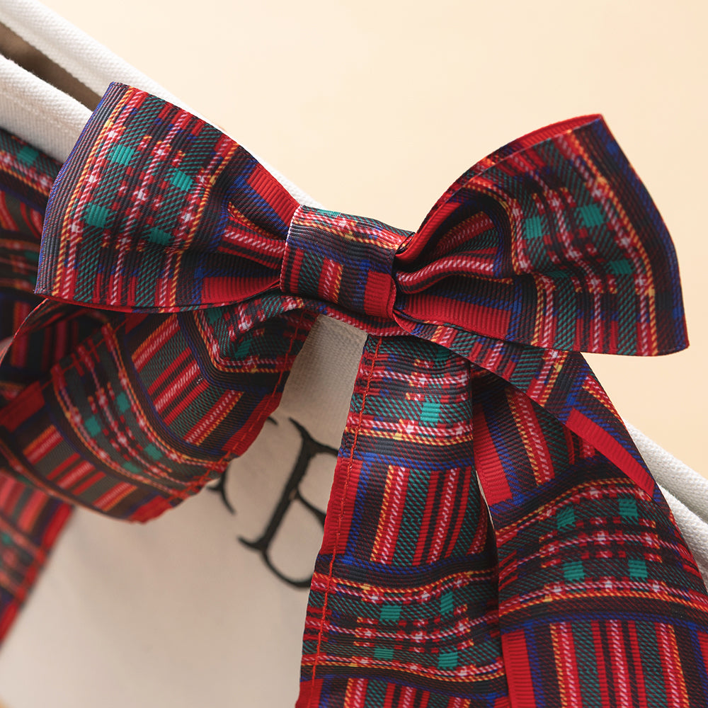 close up of bow on monogrammed plaid tote in red plaid 