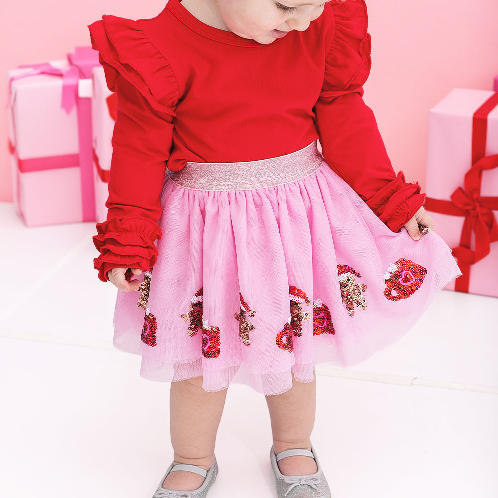 close up of girl wearing gingerbread tutu skirt 