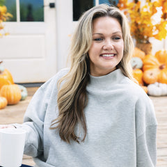 close up of girl wearing mockneck sweatshirt in heathered grey 