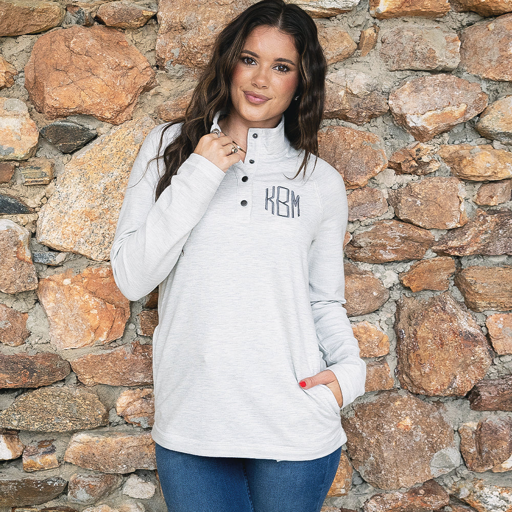 close up of girl wearing monogrammed essential pullover in heathered ivory 