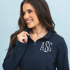 close up of girl wearing navy monogrammed lightweight waffle quarter zip pullover 