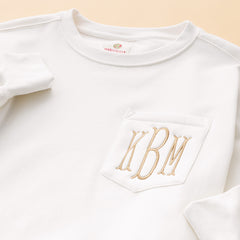 close up of ivory monogrammed oversized sweatshirt 