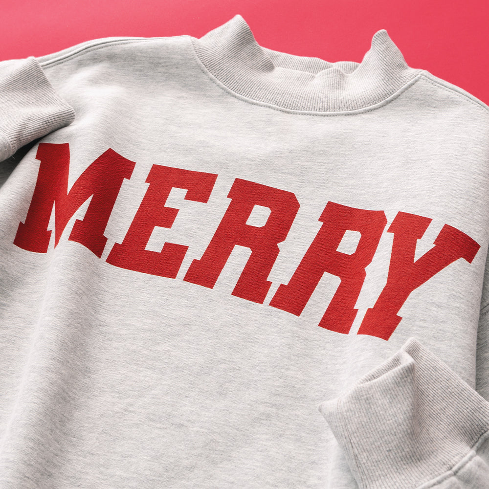 close up of merry mockneck sweatshirt 