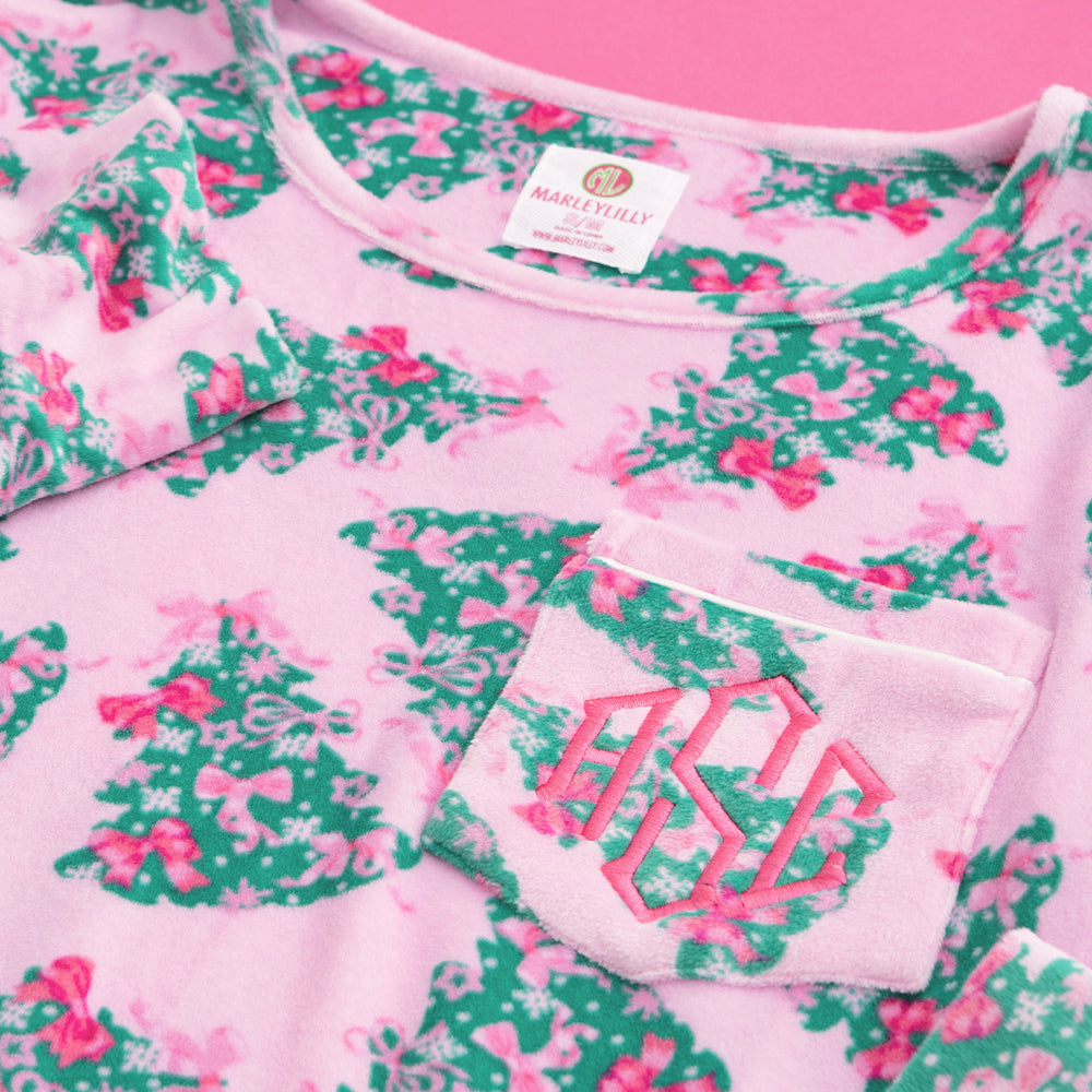 close up of monogram nightgown in pink christmas trees