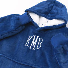 close up of monogram on kids blanket hoodie in blue