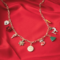 close up of red and green monogrammed christmas charm necklace 