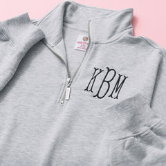 close up of monogrammed oversized quarter zip pullover in heathered grey 