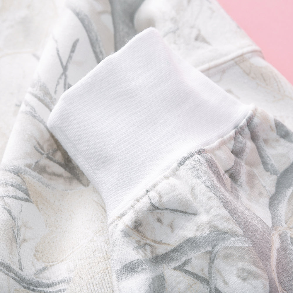 close up of monogrammed oversized sweatshirt in birch camo 