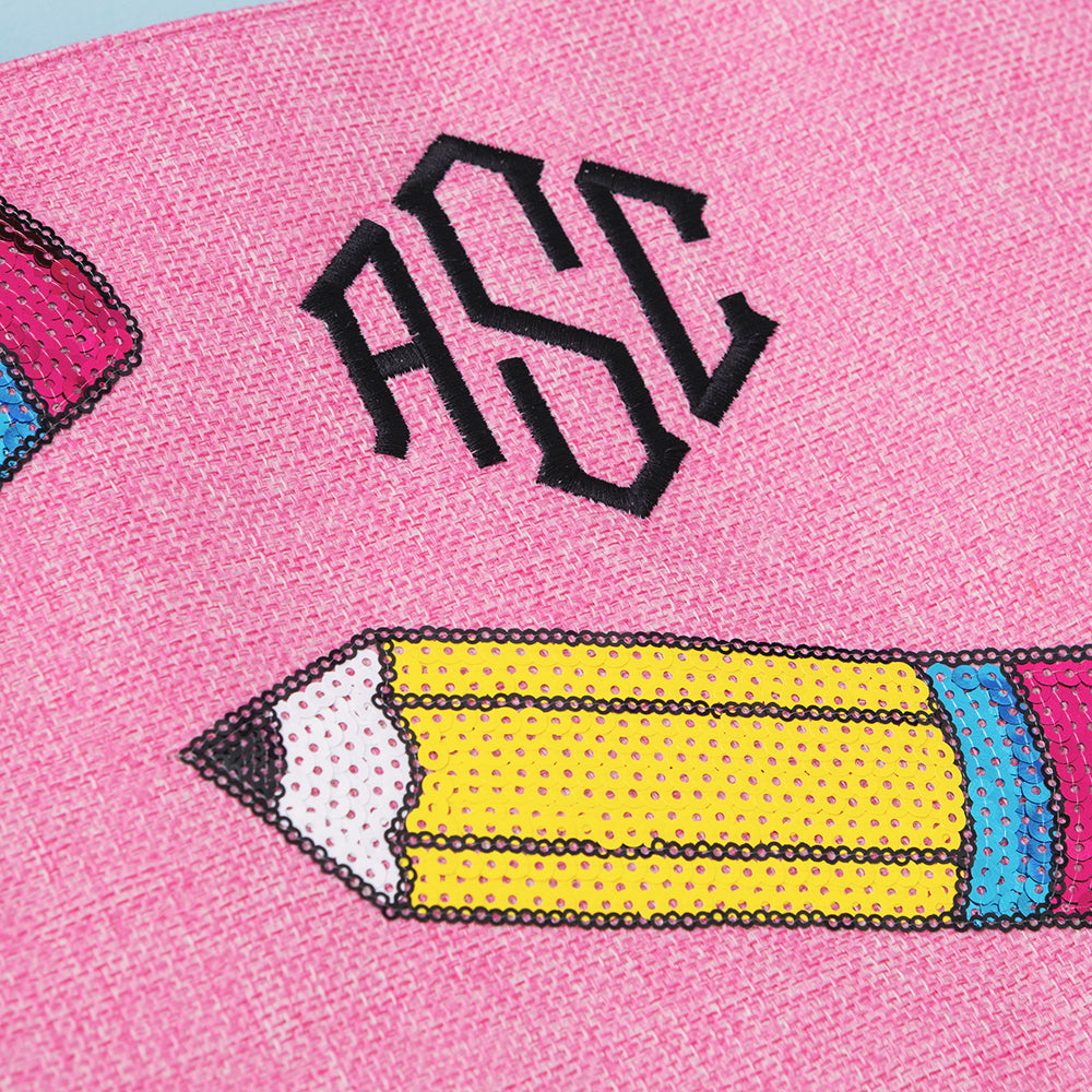 close up of monogrammed sequin tote bag in pink pencils 